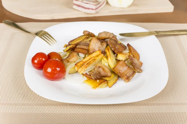Fried potatoes with bacon — Stock Photo, Image